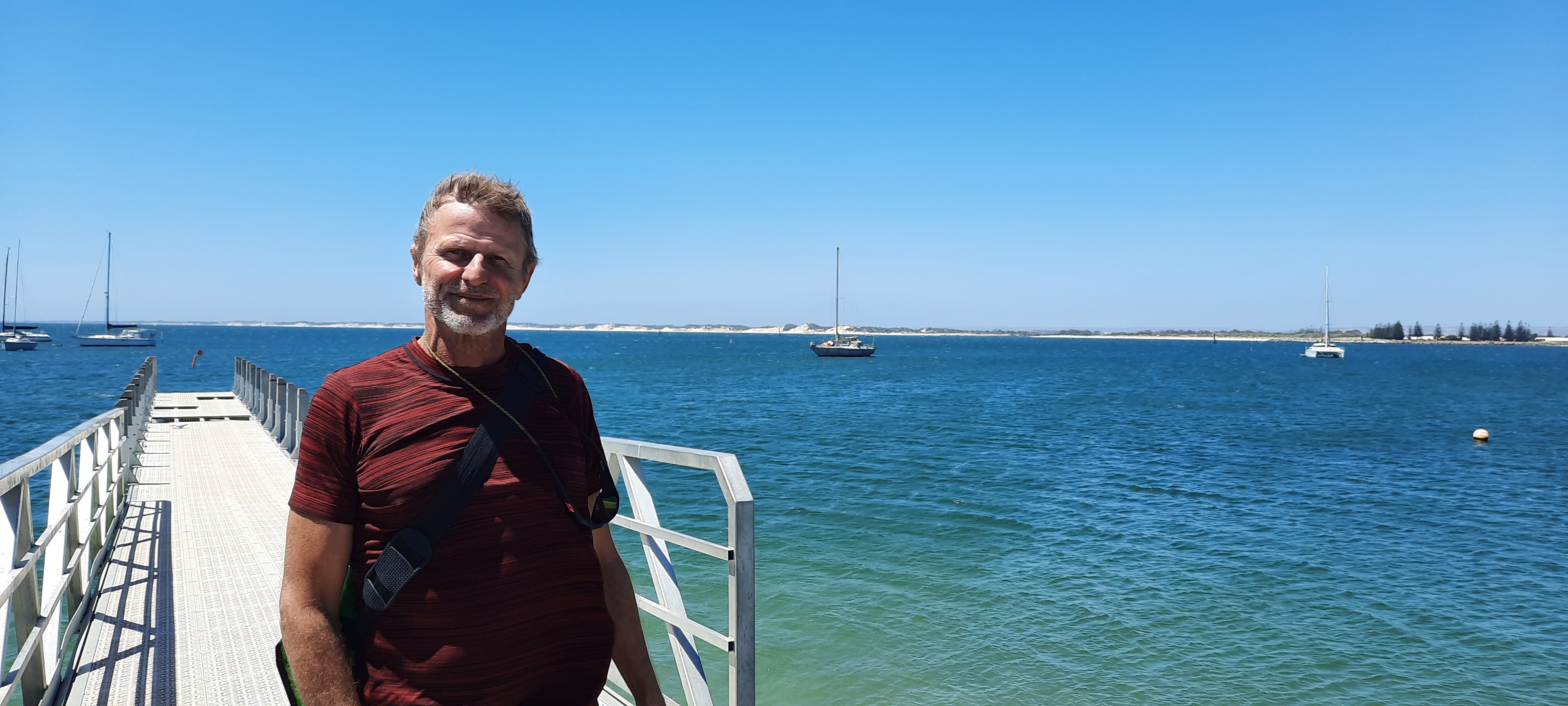 Sailor Ralph Bender with his boat in Koombana Bay