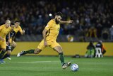 Mile Jedinak scores against Japan in a 2016 World Cup qualifier in Melbourne.