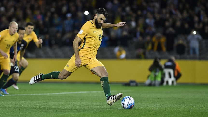 Mile Jedinak scores from the spot against Japan