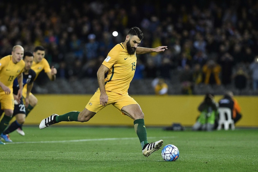 Mile Jedinak scores from the spot against Japan