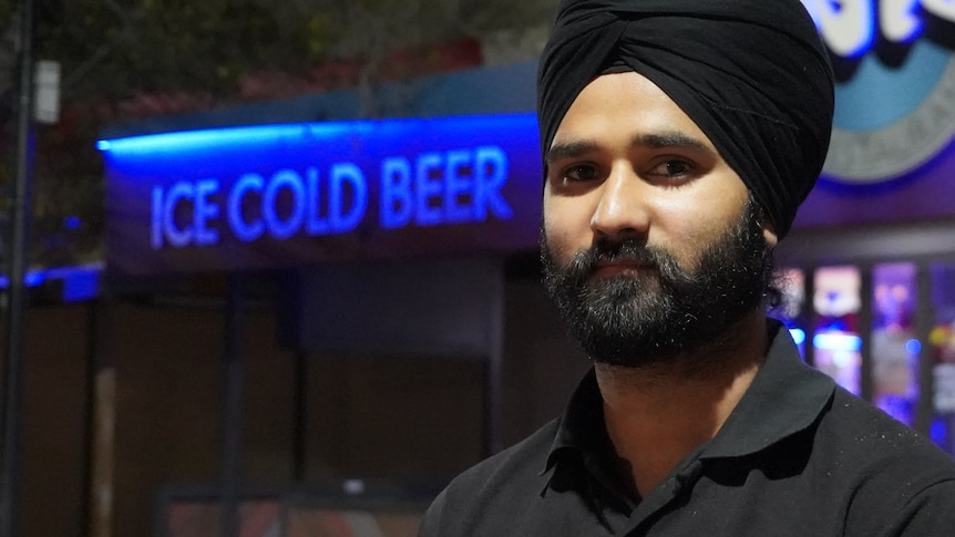 Harpinder Singh looks at the camera at night in Alice Springs.