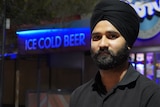 Harpinder Singh looks at the camera at night in Alice Springs.
