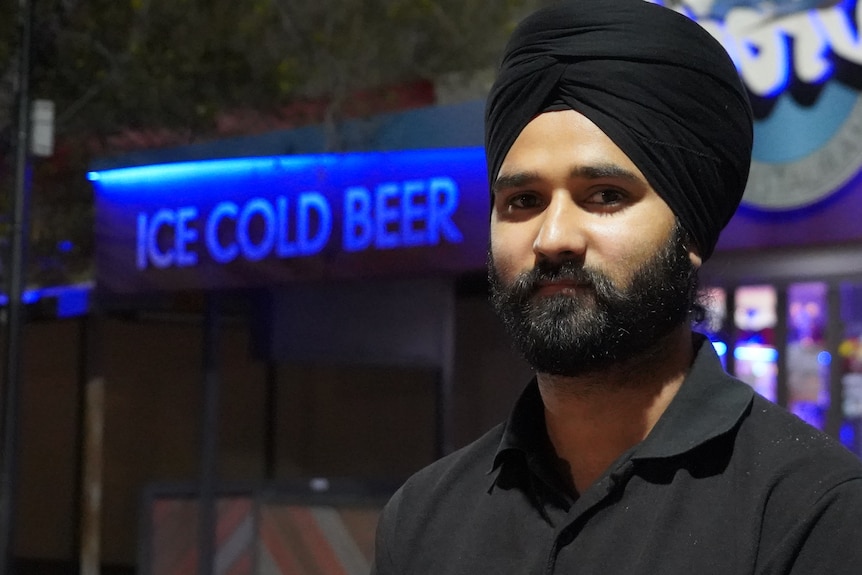 Harpinder Singh looks at the camera at night in Alice Springs.