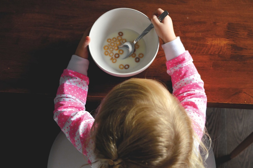 Girl eating cereal.