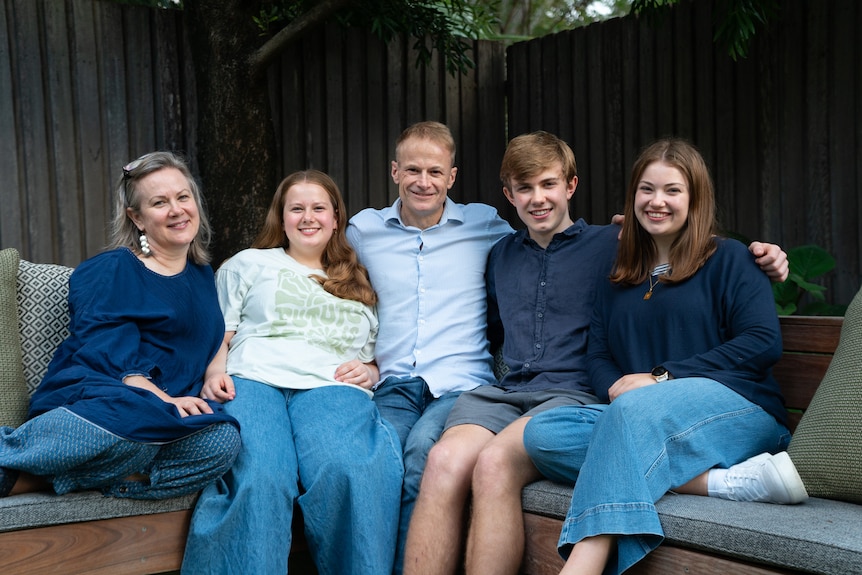 Richard Scolyer with his wife Katie and three kids outdoor sofa