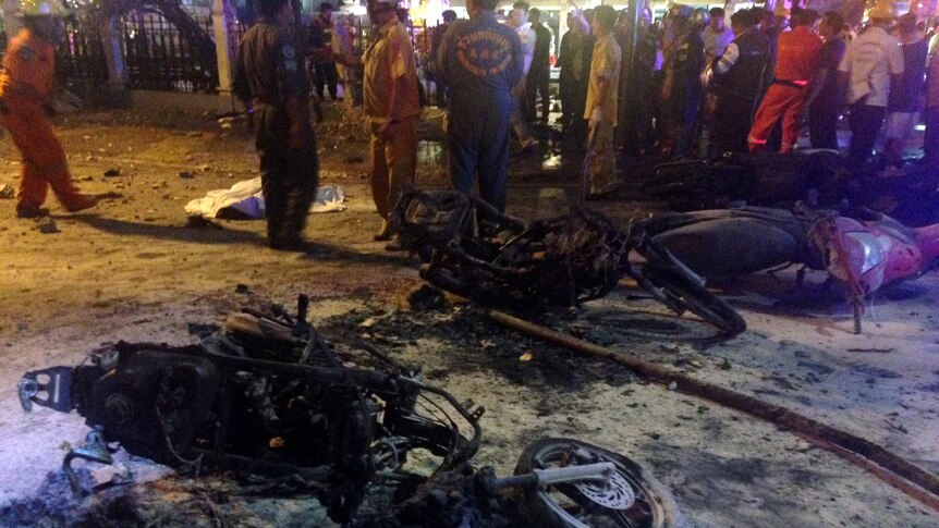 Destroyed motorbikes at the scene of a bomb blast outside a religious shrine in central Bangkok