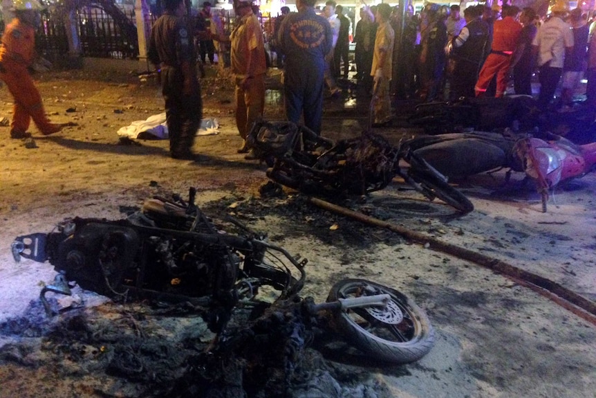 Destroyed motorbikes at the scene of a bomb blast outside a religious shrine in central Bangkok