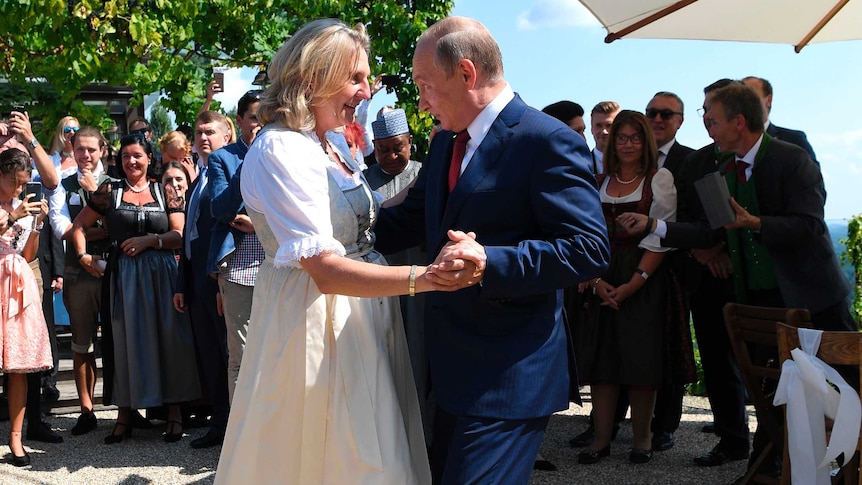 Vladimir Putin dances with Austrian Foreign Minister Karin Kneissl