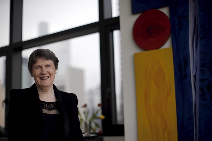 You view Helen Clark in a loft-style apartment surrounded by modernist artworks on an overcast day.