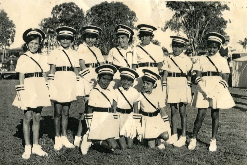 A black and white photo of Cherbourg marching girls in 1961, location unknown.