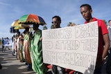 Eritreans at a memorial for migrant shipwreck victims in Italy