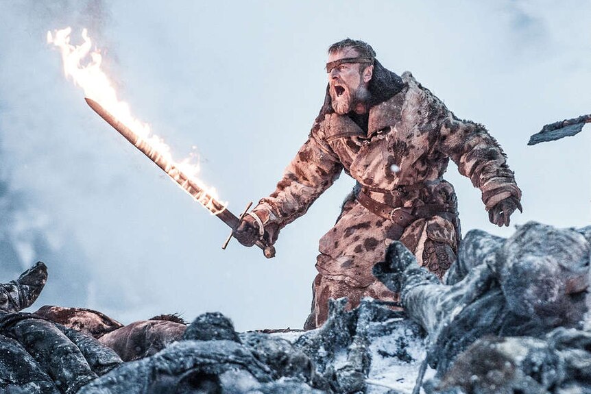 Beric Dondarrion fights wights with his flaming sword.