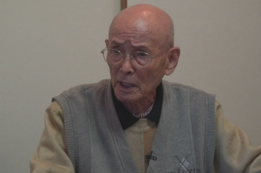 Pearl Harbor veteran Kuniyoshi Takimoto, 95, has an angry look on his face as he speaks.