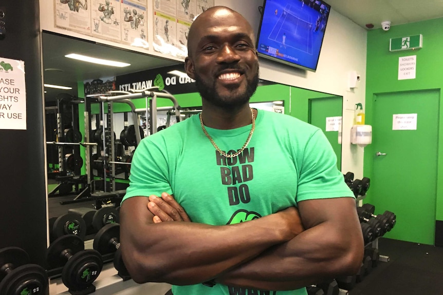 A man stands in a gym