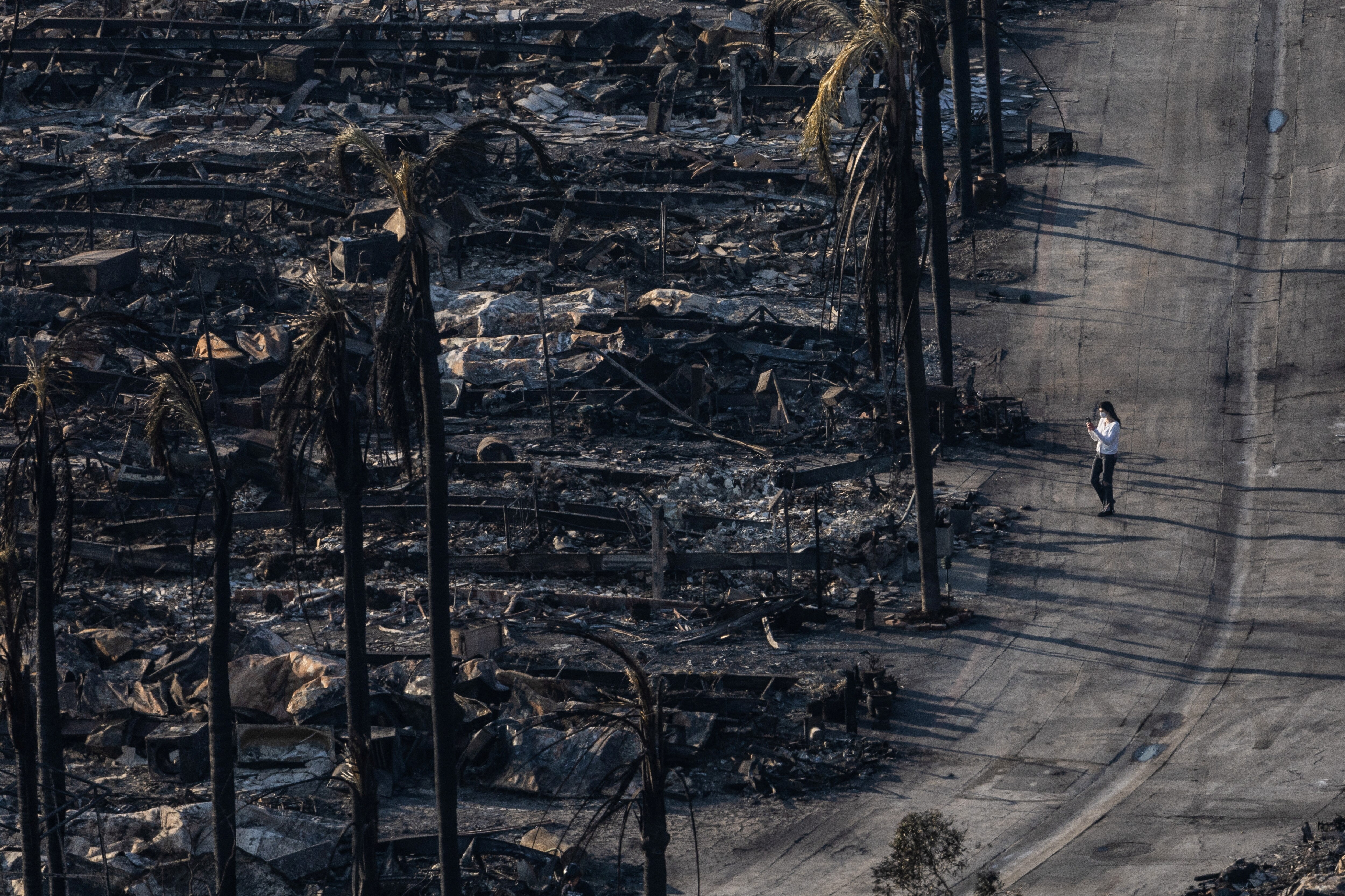 Remains of burnt homes can be seen from above in the Pacific Palisades