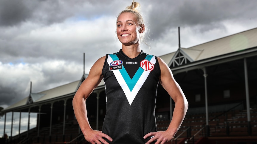 Erin Phillips smiles, pictured in a Port Adelaide jumper at Alberton Oval