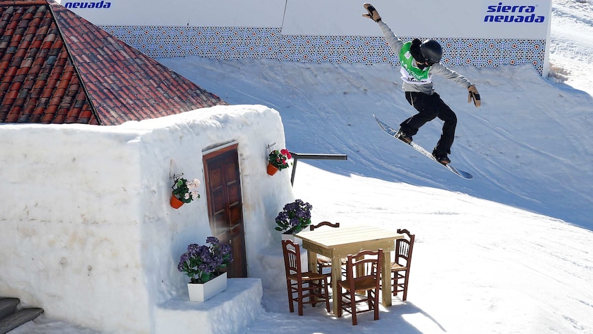 Australian snowboarder Tess Coady jumps on the slopestyle course at FIS Snowboarding world titles.