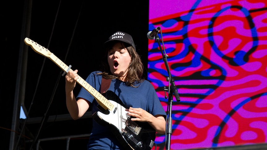 Courtney Barnett playing guitar at the Byron Falls Festival