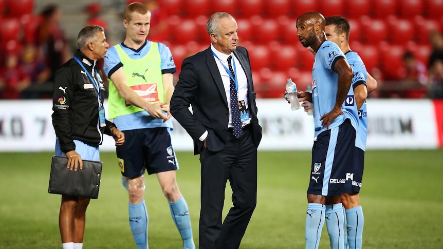 No concern ...  Graham Arnold (C) meets with his Sydney FC players after the 2-2 draw with Adelaide United