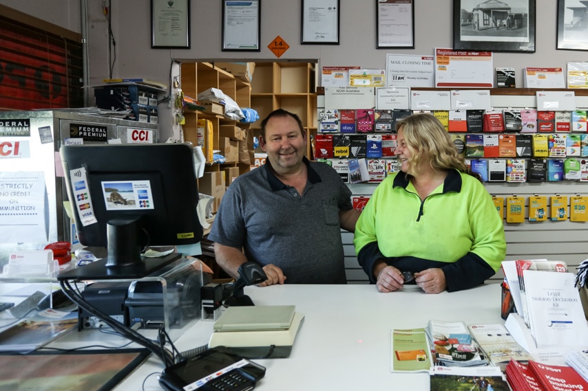 A couple behind the counter in a country store