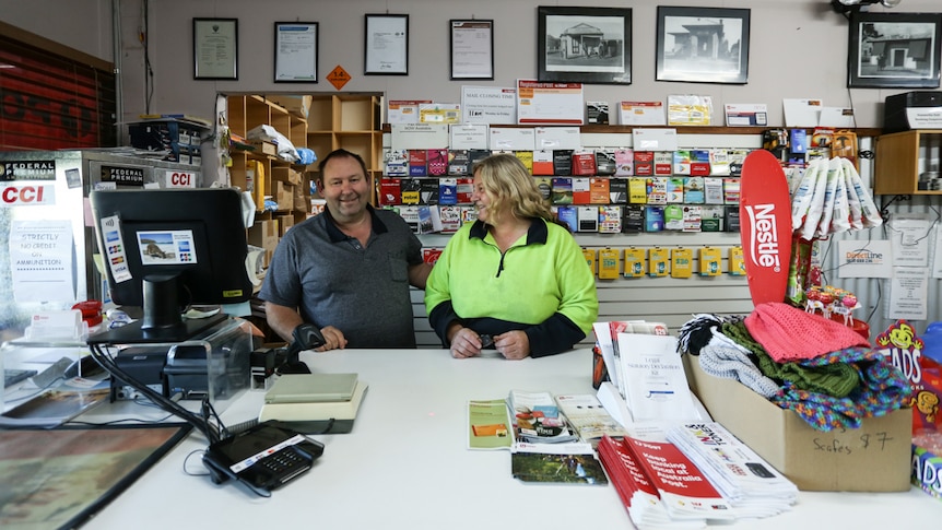 A couple behind the counter in a country store