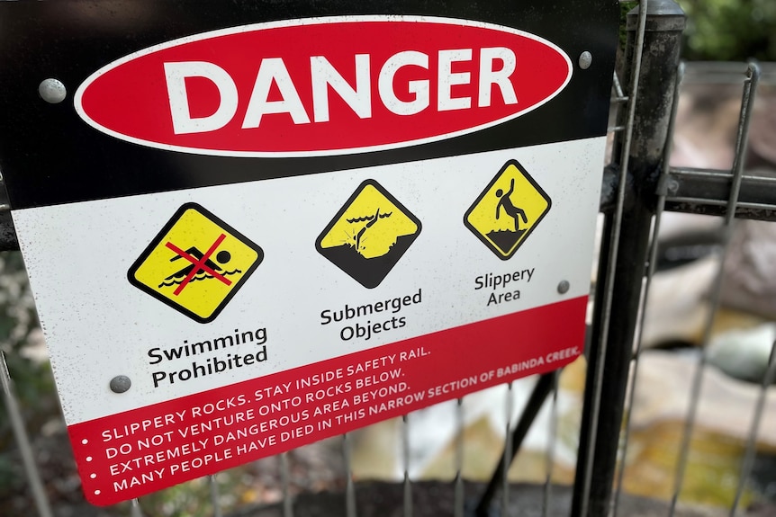 Warning sign at Babinda Boulders in December 2021 after a woman was found dead in Devil's Pool