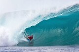 Bodyboarder Mike Stewart gets tubed at Pipeline