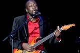 Wyclef Jean sings onstage