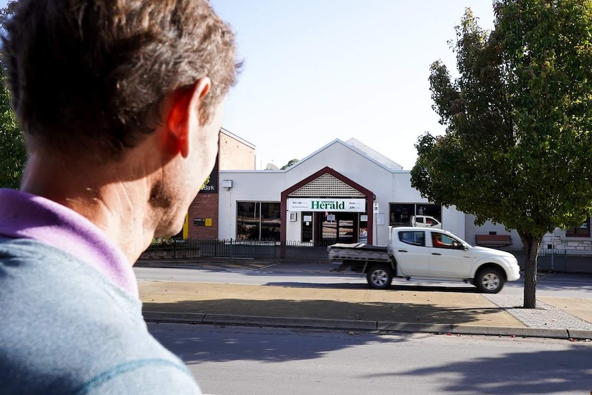 Michael Waite looks across the road from outside his new newspaper office at the old Naracoorte Herald building.