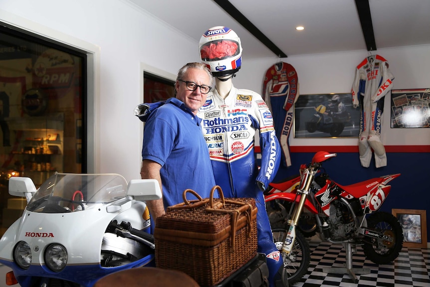 Motorcycle racing champion Wayne Gardner inspects items of his donated memorabilia at the Australian Motorlife Museum in Dapto.
