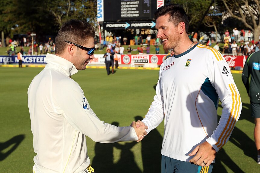 Australia cricket captain Michael Clarke and South Africa cricket captain Graeme Smith shake hands after a 2014 Test series.
