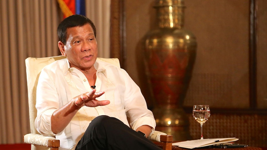 President of the Philippines Rodrigo Duterte sits on an armchair.