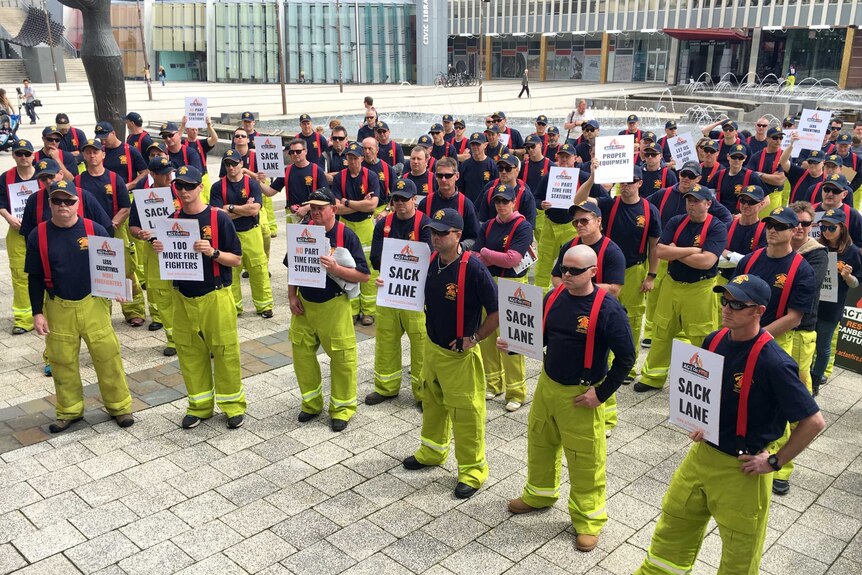 A group of ACT firefighters protesting near the Legislative Assembly in Canberra.