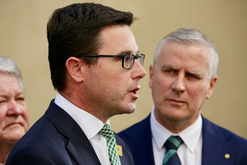 David Littleproud speaking at a press conference as Nationals leader Michael McCormack looks on