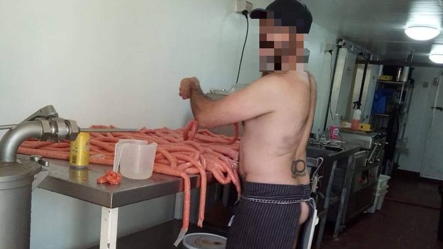 A butcher stands naked in a meat supplier in Kalkarindji.