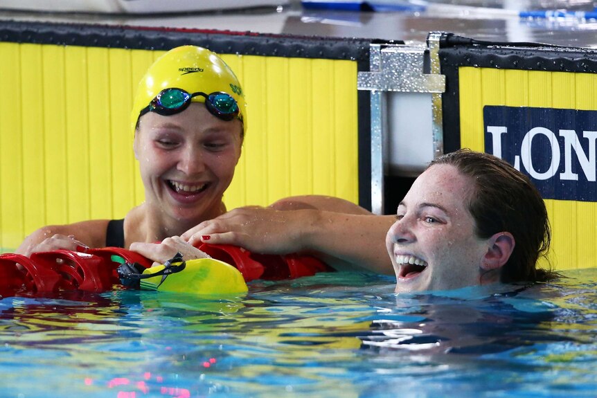 Campbell and Schlanger share a laugh in the pool