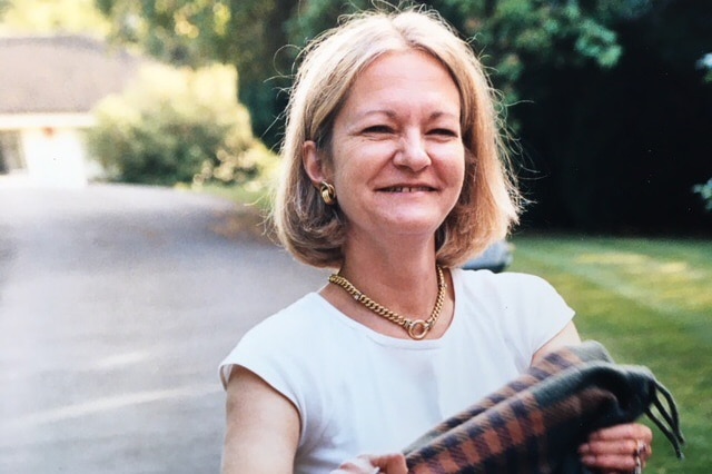 A woman with blonde hair smiling