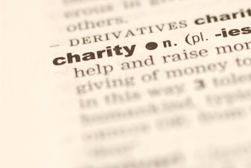 Dictionary open at the definition of charity (Thinkstock: Hemera Technologies)