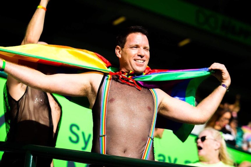 Mardi Gras man with flag