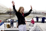 Dutch teenager Laura Dekker, 14, waves goodbye as she leaves the port in Den Osse