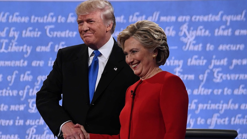 Democratic nominee Hillary Clinton shakes hands with Republican nominee Donald Trump during the first presidential debate