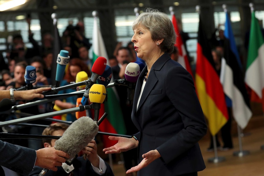 UK Prime Minister Theresa May speaks to international media in Brussels.