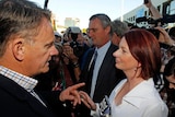 Prime Minister Julia Gillard is confronted by former Labor leader Mark Latham at Brisbane's Ekka sho