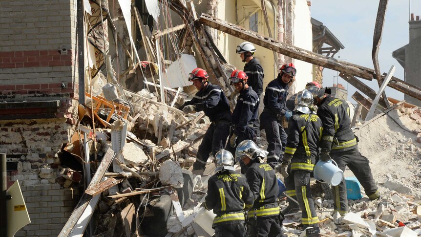 Paris building collapse kills child