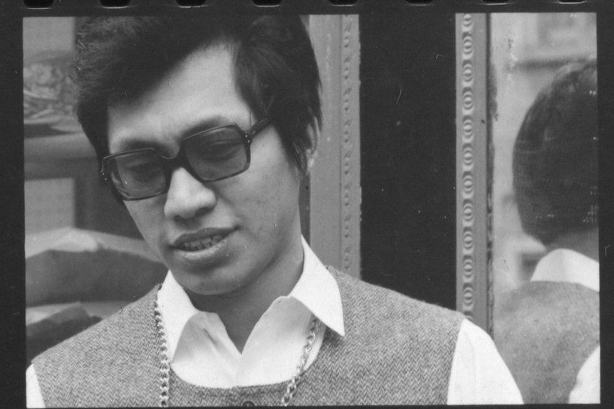 A young Rodriguez in a collared shirt and glasses