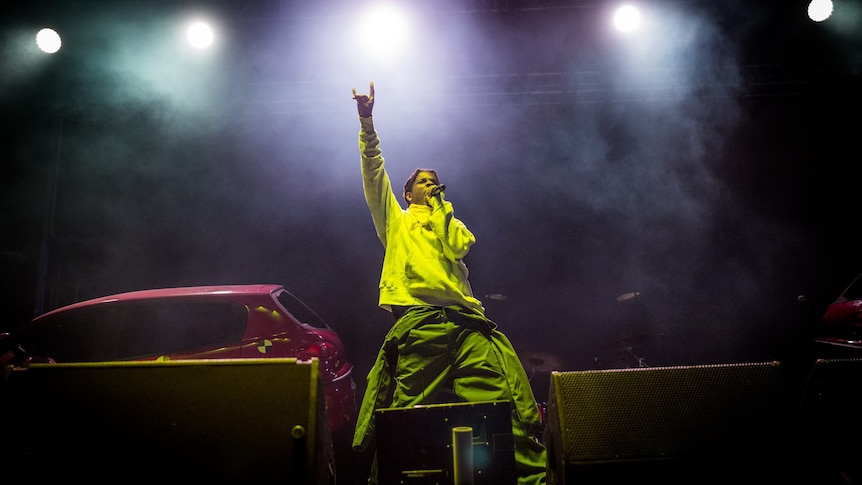 A$AP Rocky live on stage at Listen Out Festival in yellow hoodie