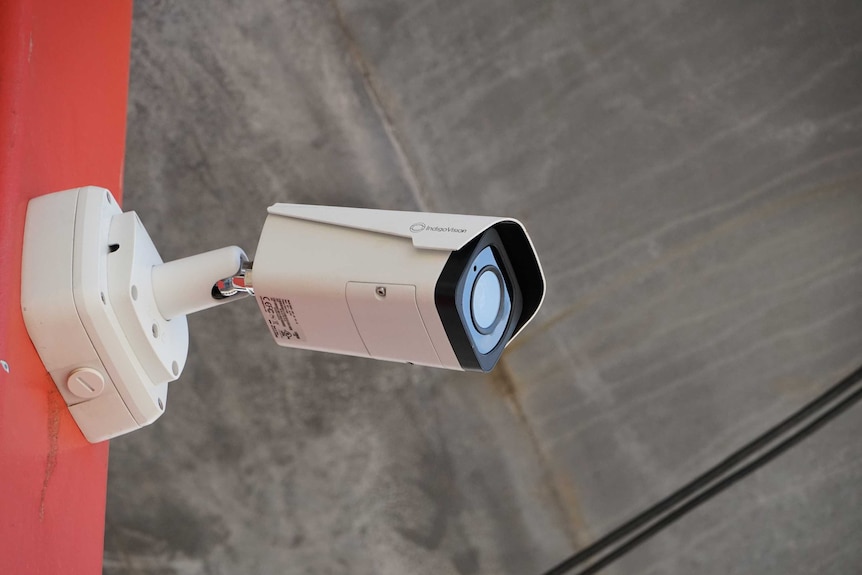 A CCTV camera mounted on a wall.