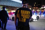 The back of a man's t-shirt reads Tyranny Response Team