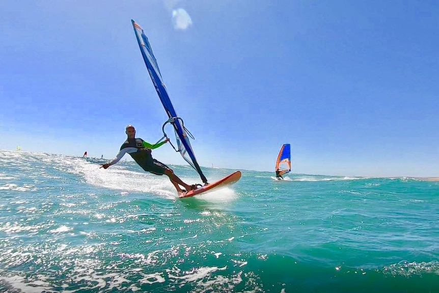A windsurfer in the water at Coronation Beach, near Geraldton, in WA's Midwest.