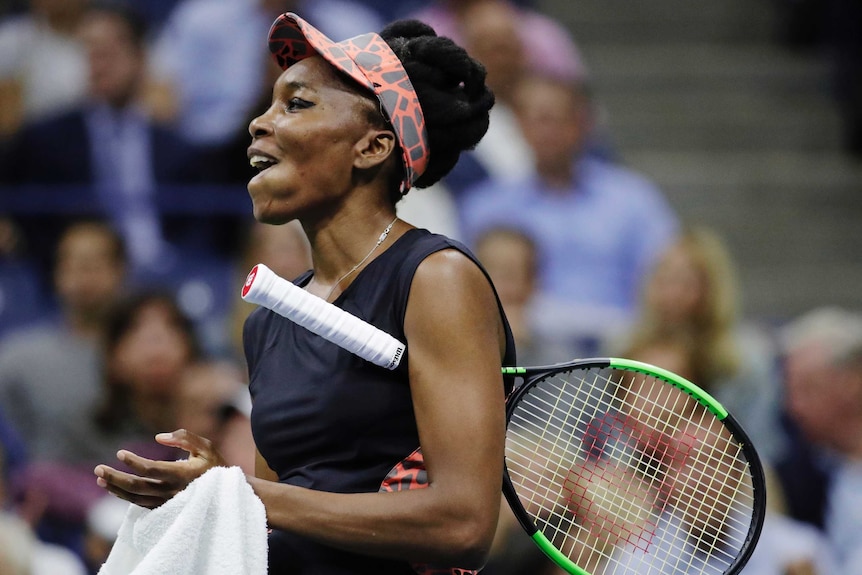 Venus Williams makes a facial expression after giving up a point to Sloane Stephens during their US Open semi-final.